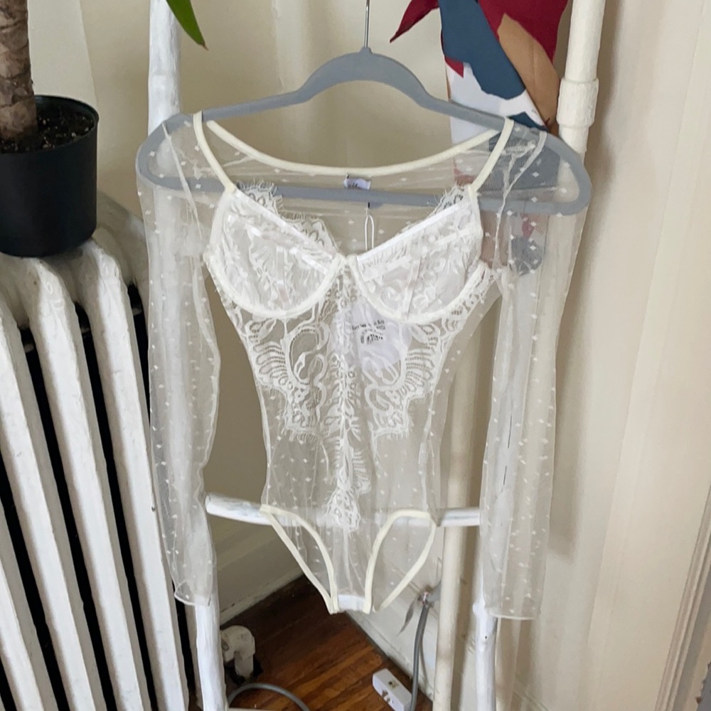 NWT. Princess Polly white body suit.